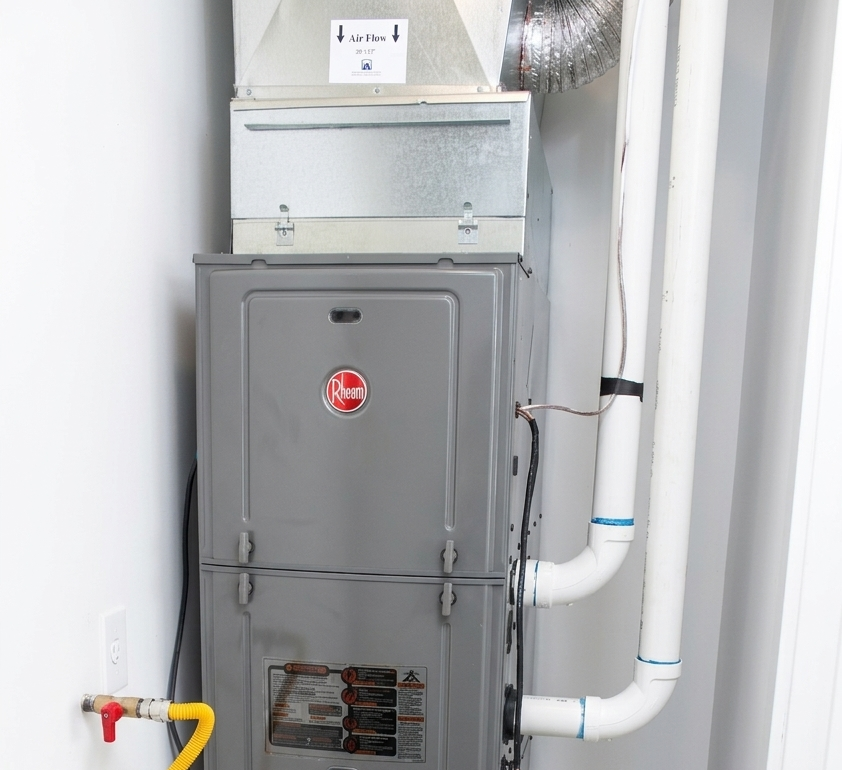 residential gas furnace with plumbing and electrical