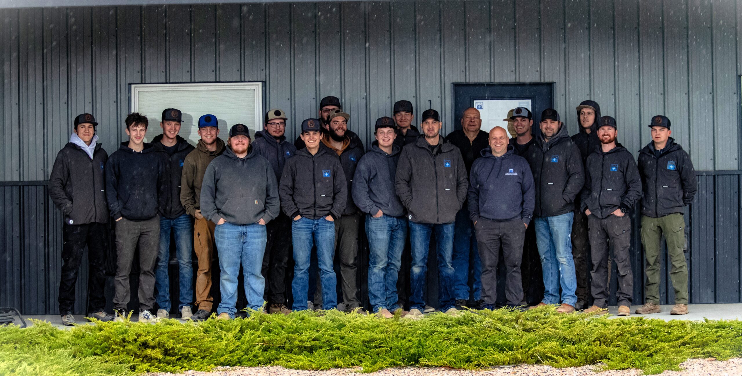 About Us TS Mechanical team photo in front of the shop building